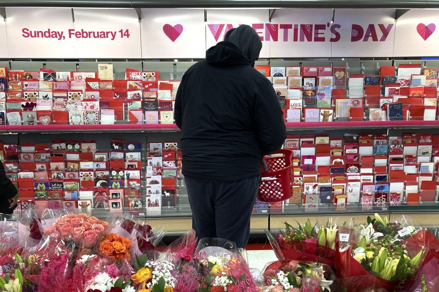 A shopper at a Chicago area store looks over Valentine&#039;s Day cards Saturday.