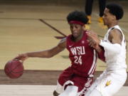 Washington State guard Noah Williams (24) drives past Arizona State guard Alonzo Verge Jr. during the second half of an NCAA college basketball game Saturday, Feb. 27, 2021, in Tempe, Ariz.