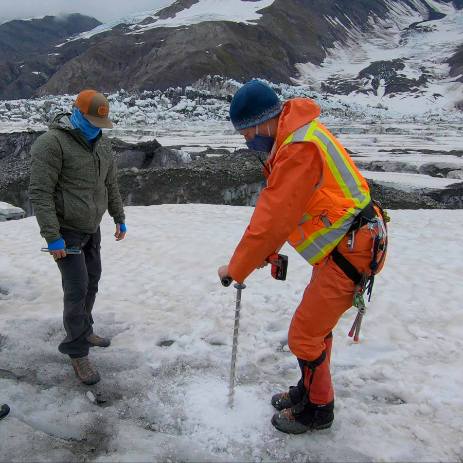Thomas Otheim, left, a lab technician at Boise State University, and Tim Bartholomaus, a University of Idaho glaciologist, perform research on the Turner Glacier in Alaska.