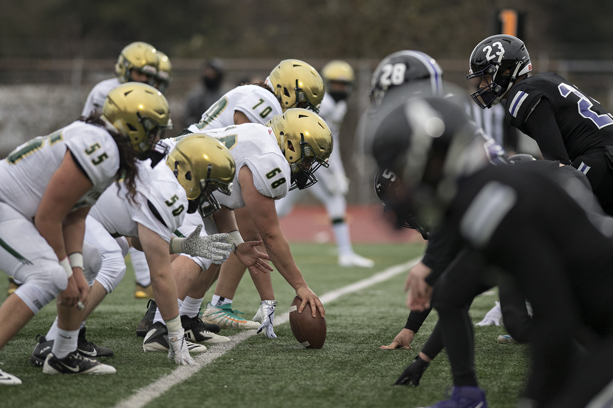 Evergreen players face off against Heritage defenders in the second quarter at McKenzie Stadium on Friday afternoon, March 5, 2021.