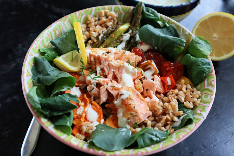 A grain bowl with roasted veggies and lemon-garlic salmon is a great way to kick off fish Fridays for Lent.
