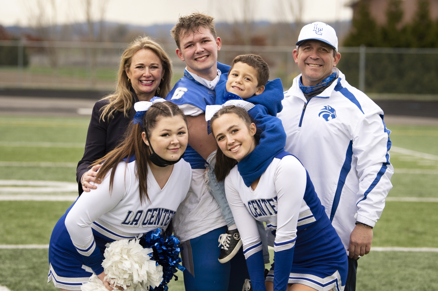 The Lambert family poses for a picture following a football game at Woodland High School. Pictured in back row, from left, are Kerry, Tom, Scotty and John. In front are Lynda and Mary. The Lambert family has always revolved around La Center football, where John has coached for 22 years.