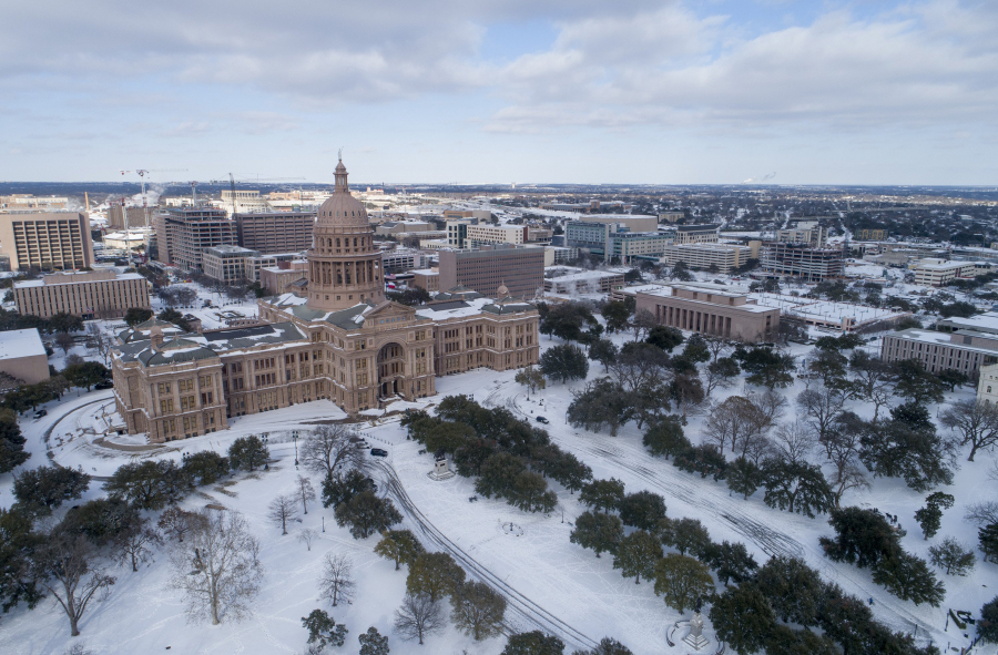 The Texas Capitol grounds are covered in snow on Monday, Feb. 15, 2021, in Austin, Texas.