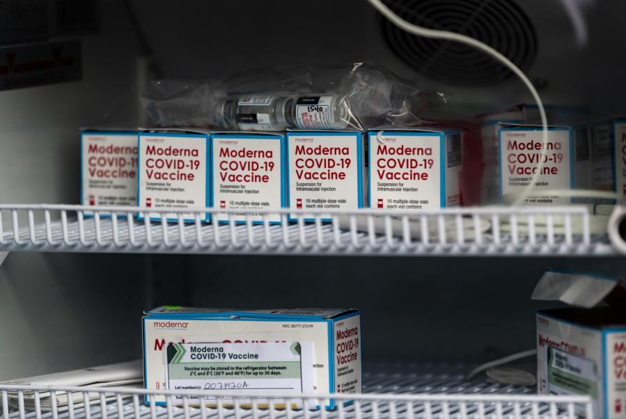 Vials of Moderna COVID-19 vaccine sit in a refrigerator in Riverside, California. The drugmaker announced Tuesday it is beginning trials of the vaccine in children as young as 6 months.