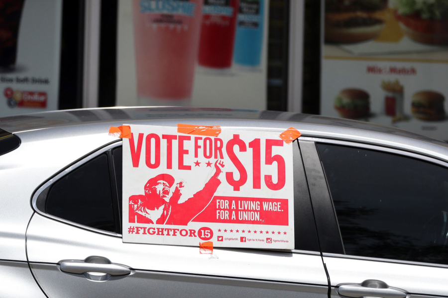 A caravan carrying protesting fast-food employees with the Florida for $15 coalition goes through the drive-through at McDonald&#039;s in Fort Lauderdale on Thursday, Sept. 16, 2020. A new study finds that the federal Bureau of Labor Statistics drastically overestimates U.S. worker wage levels.