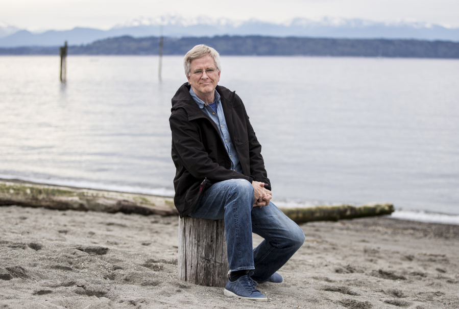 Rick Steves sits on the beach in downtown Edmonds in April 2020.