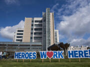 A sign outside PeaceHealth Southwest Medical Center honors hospital staff working hard to treat patients during the COVID-19 crisis April 2, 2020.