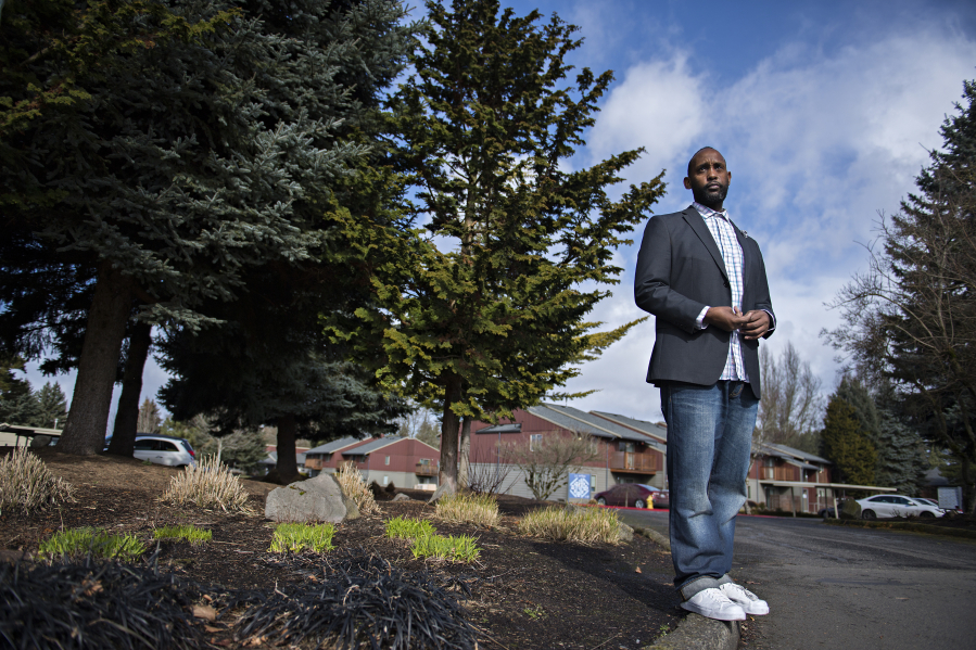 Pastor Damion Young, who contracted COVID-19 and still struggles with symptoms, poses for a portrait at his Vancouver apartment complex. Young worked as an Amazon truck driver, but has struggled to return to work because of long-term symptoms from COVID-19.