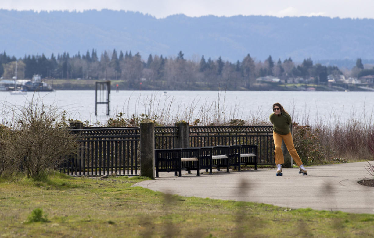 Anna Miller of Vancouver takes in the view during a scenic skate along the Waterfront Renaissance Trail on Monday afternoon. The area is also popular with walkers, runners, boat enthusiasts and cyclists. Forbes named Vancouver the No. 2 place in America to visit during the pandemic.
