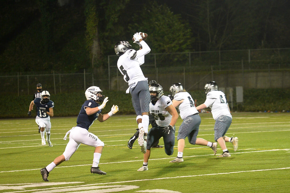 Union receiver Tobias Merriweather makes a catch against Skyview at Kiggins Bowl on Friday night, March 12, 2021.
