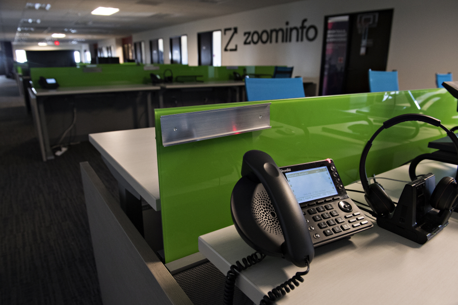 Deserted desks line the main office of ZoomInfo in downtown Vancouver.(Amanda Cowan/The Columbian)