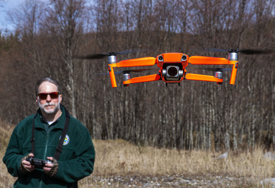Washington Department of Fish and Wildlife habitat biologist George Fornes flies a drone near the North Fork of the Toutle River to survey potential locations for a new fish release site on Wednesday.
