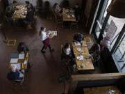 Customers dine at La Provence Vancouver&#039;s socially distanced dining area as lunch is served Thursday afternoon.