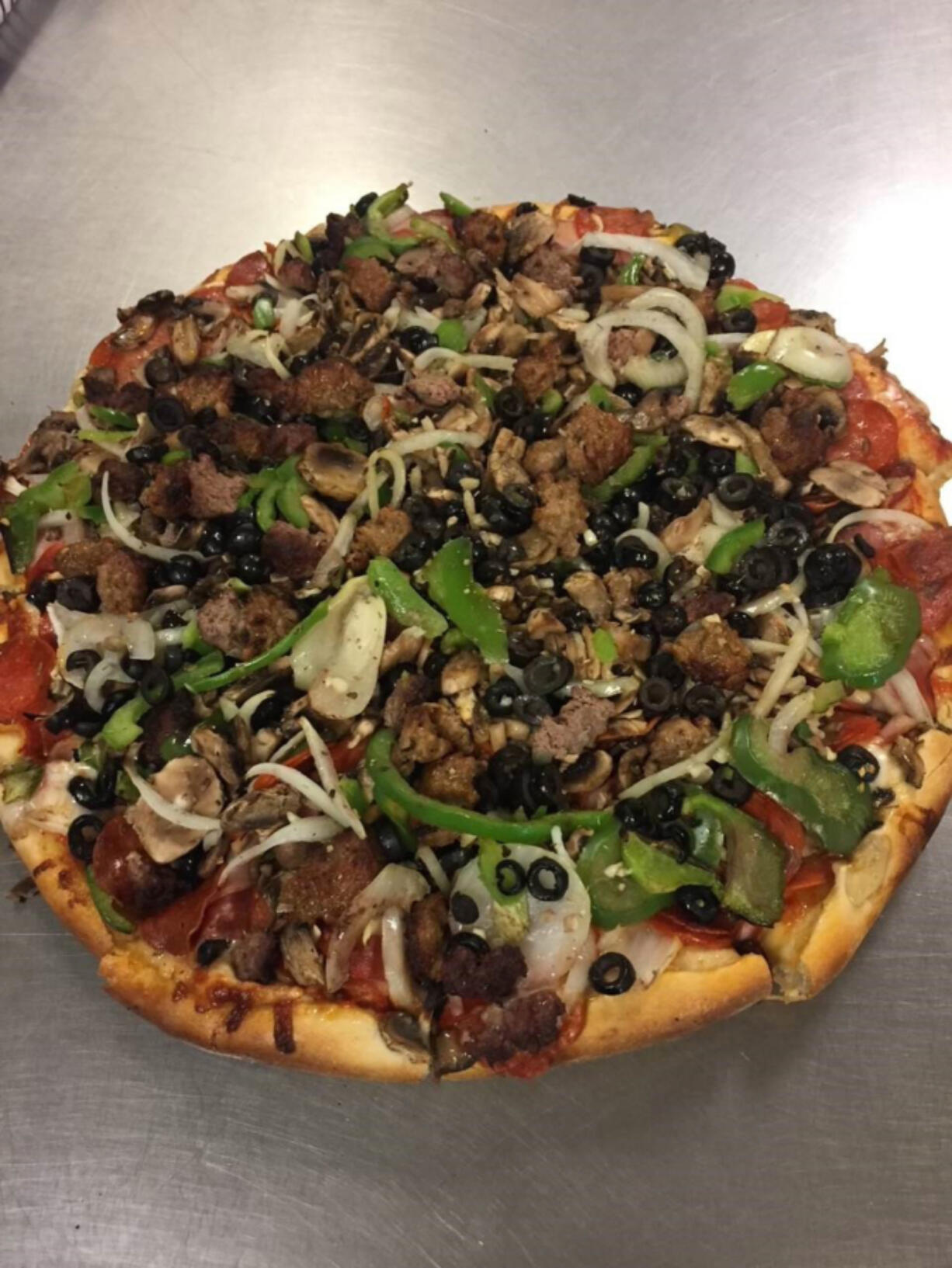 The Hurricane is Juliano&#039;s signature pie. It&#039;s topped with pepperoni, salami, onions, Canadian bacon, mushrooms, green peppers, black olives, beef and sausage.