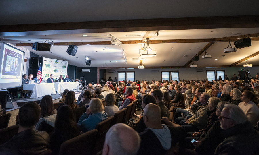 A crowd of more than 200 people listens to opening remarks from candidates running to represent Washington&#039;s 3rd Congressional District on Tuesday during a forum at Church on the Rock in Battle Ground.