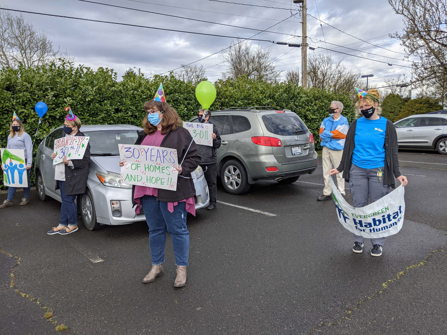 ELLSWORTH SPRINGS: Volunteers, staff and board members held a socially-distant event outside the Clark County Habitat for Humanity Store on March 18 to celebrate its 30th birthday.