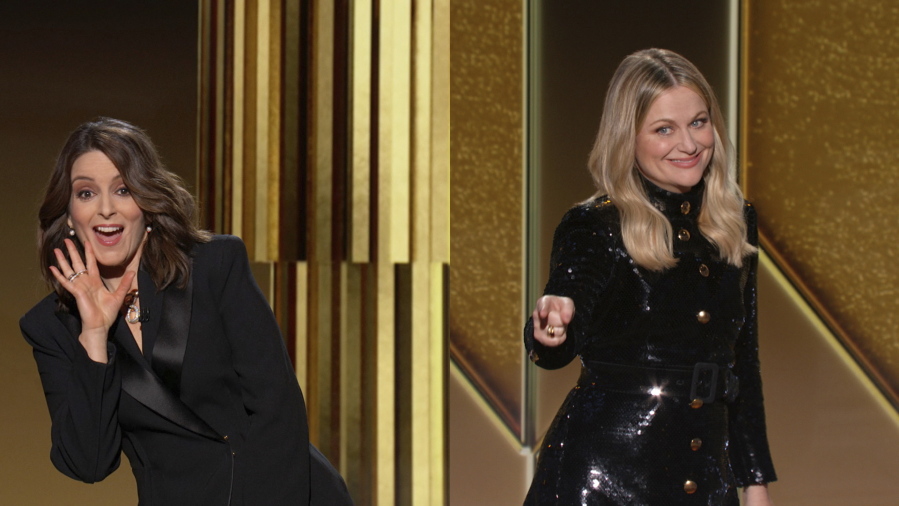 In this video grab issued Sunday, Feb. 28, 2021, by NBC, hosts Tina Fey, left, from New York, and Amy Poehler, from Beverly Hills, Calif., speak at the Golden Globe Awards.