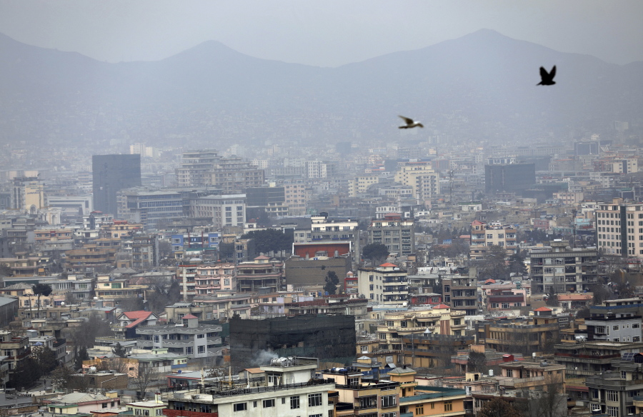 FILE - In this Feb. 1, 2021 file photo, birds flyover the city of Kabul, Afghanistan. The United States wasted billions of dollars in war-torn Afghanistan on buildings and vehicles that were either abandoned or destroyed, according to a report released Monday, March 1, 2021, by the Special Inspector General for Afghanistan Reconstruction, a U.S. government watchdog.