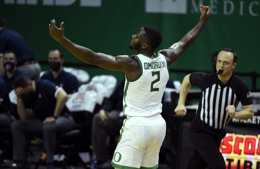Oregon forward Eugene Omoruyi (2) celebrates after making a three-point basket against Arizona during the first half of an NCAA college basketball game Monday, March 1, 2021, in Eugene, Ore.