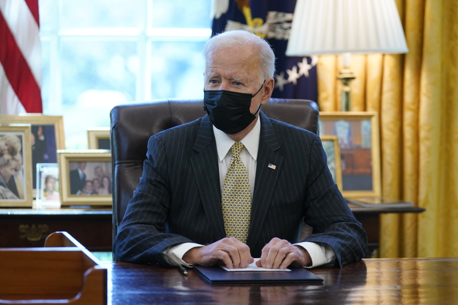President Joe Biden speaks after signing the PPP Extension Act of 2021, in the Oval Office of the White House, Tuesday, March 30, 2021, in Washington.