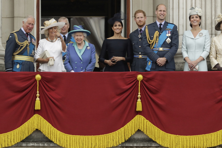 FILE - In this Tuesday, July 10, 2018 file photo, members of THE royal family gather on the balcony of Buckingham Palace, with from left, Britain&#039;s Prince Charles, Camilla the Duchess of Cornwall, Prince Andrew, Queen Elizabeth II, Meghan the Duchess of Sussex, Prince Harry, Prince William and Kate the Duchess of Cambridge, as they watch a flypast of Royal Air Force aircraft pass over Buckingham Palace in London. The timing couldn&#039;t be worse for Harry and Meghan. The Duke and Duchess of Sussex will finally get the chance to tell the story behind their departure from royal duties directly to the public on Sunday, March 7, 2021 when their two-hour interview with Oprah Winfrey is broadcast.