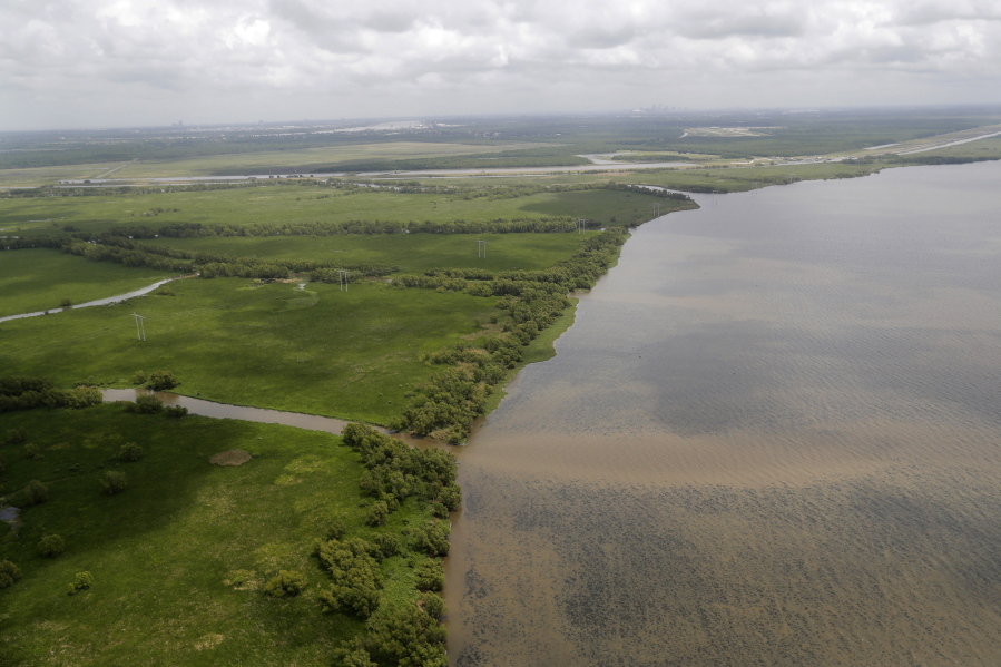 FILE - This May 1, 2019, file photo shows the Davis Pond Diversion emptying into Lake Cataouache, with tree growth on the edges of the channels in St. Charles Parish, La. A nearly $2 billion plan to divert water and sediment from the Mississippi River to rebuild land in southeastern Louisiana, a proposal considered the cornerstone of the state&#039;s efforts to protect its rapidly eroding coast, has passed a major milestone with the publication of the Army Corps of Engineers long-awaited environmental impact study, Thursday, March 4, 2021.