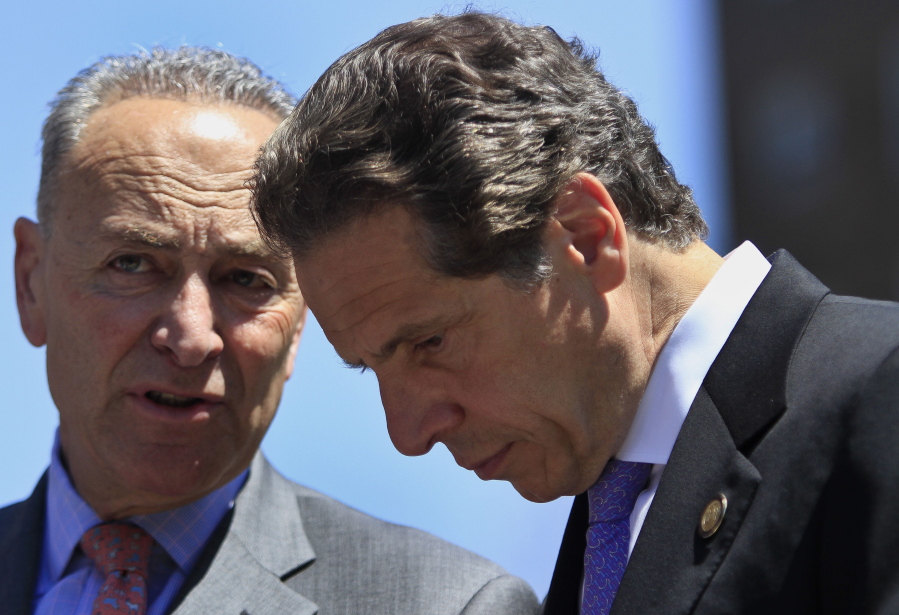 FILE - In this June 2, 2014, file photo, U.S. Sen. Charles Schumer, left, D-N.Y., speaks with New York Gov. Andrew Cuomo, right, during a press conference in New York. New York Gov. Andrew Cuomo has avoided public appearances for days as some members of his own party call for him to resign over sexual harassment allegations.