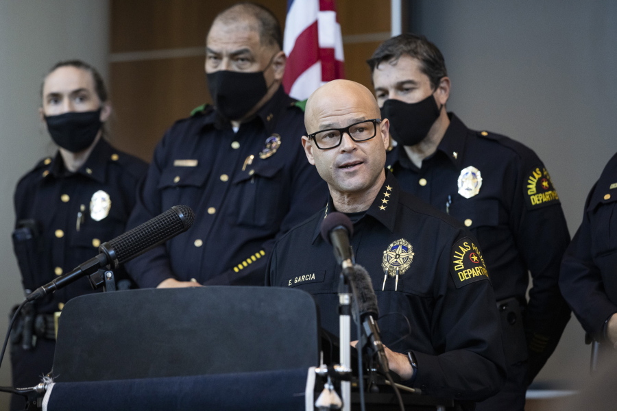 Chief Eddie Garcia, center, speaks with media during a press conference regarding the arrest and capital murder charges against Officer Bryan Riser at the Dallas Police Department headquarters on Thursday, March 4, 2021, in Dallas. Riser was arrested Thursday on two counts of capital murder in two unconnected 2017 killings that weren&#039;t related to his police work, authorities said. Riser, a 13-year veteran of the force, was taken into custody Thursday morning and brought to the Dallas County Jail for processing, according to a statement from the police department. (Lynda M.