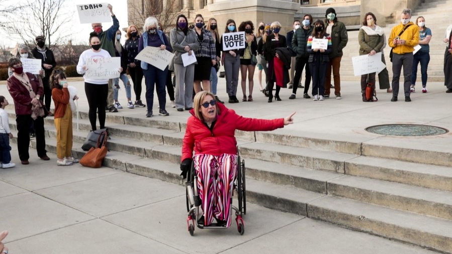 State Rep. Muffy Davis, D-Ketchum, rallies demonstrators at the Idaho Statehouse on Wednesday in Boise, Idaho. They decried the decision to kill a bill would have would provided $6 million in federal grants for early childhood education.