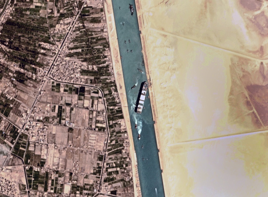 This satellite photo from Planet Labs Inc. shows the Ever Given cargo ship stuck in Egypt&#039;s Suez Canal Monday, March 29, 2021. Engineers on Monday &quot;partially refloated&quot; the colossal container ship that continues to block traffic through the Suez Canal, authorities said, without providing further details about when the vessel would be set free. (Planet Labs Inc.