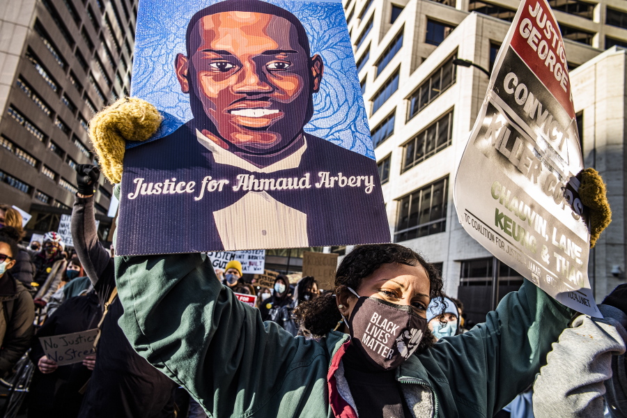 Protesters march downtown in Minneapolis, Minn., on the first day of the Derek Chauvin trial which began with jury selection, Monday, March 8, 2021.
