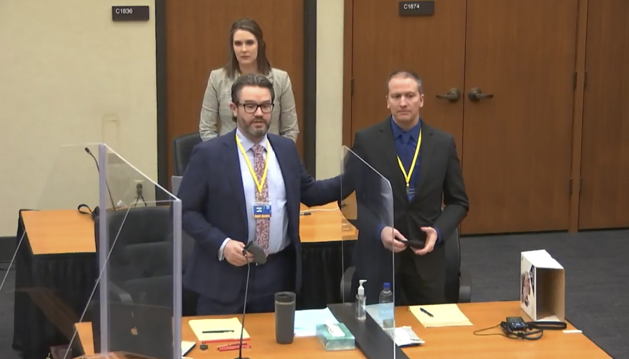 In this screen grab from video, defense attorney Eric Nelson, left, defendant and former Minneapolis police officer Derek Chauvin, right, and Nelson&#039;s assistant Amy Voss, back, introduce themselves to potential jurors as Hennepin County Judge Peter Cahill Tuesday, March 23, 2021, presides over jury selection in the trial of Chauvin at the Hennepin County Courthouse in Minneapolis, Minn.   Chauvin is charged in the May 25, 2020 death of George Floyd.