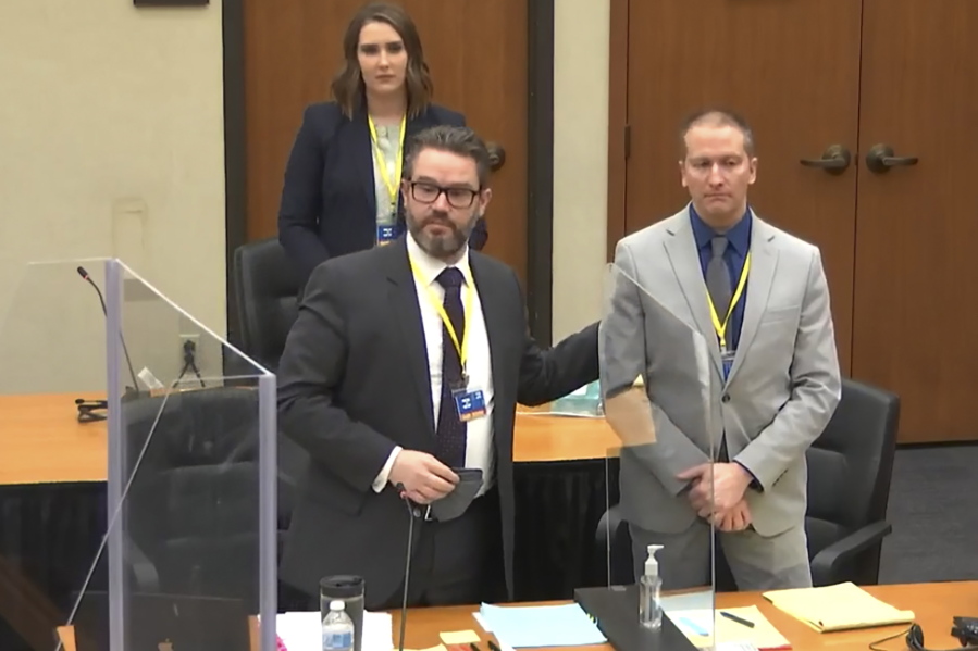 In this screen grab from video, defense attorney Eric Nelson, left, defendant and former Minneapolis police officer Derek Chauvin, right, and Nelson&#039;s assistant Amy Voss, back, introduce themselves to jurors as Hennepin County Judge Peter Cahill presides over jury selection in the trial of Chauvin Wednesday, March 17, 2021 at the Hennepin County Courthouse in Minneapolis, Minn.  Chauvin is charged in the May 25, 2020 death of George Floyd.