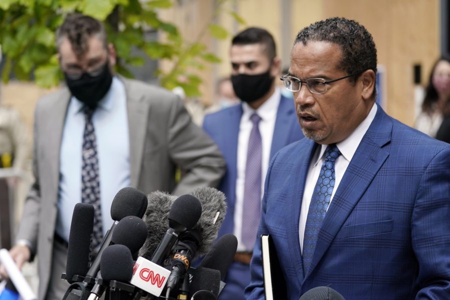 FILE - In this Sept. 11, 2020 file photo, Minnesota Attorney General Keith Ellison, right, addresses reporters outside the Hennepin County Family Justice Center in Minneapolis. Jury selection begins Monday, March 8, 2021, for Derek Chauvin, a former Minneapolis police officer charged with murder and manslaughter in George Floyd&#039;s death. Ellison is the lead prosecutor in the case.