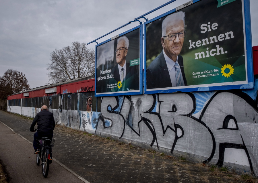 Election posters show Winfried Kretschmann from the Greens and the party&#039;s top candidate for the Baden-Wurttemberg federal state elections in Mannheim, Germany, Wednesday, March 10, 2021. The elections will take place next Sunday. Letters on left poster read &quot;edges stabilize&quot;, letters on right poster read &quot;you know me&quot;.