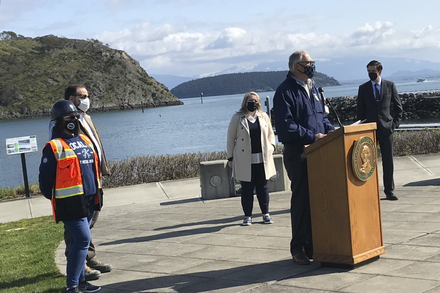 Washington Gov. Jay Inslee urges the passage of House Bill 1091 and Senate Bill 5126, which would address the increasing effects of climate change, Tuesday, March 30, 2021, at Seafarers&#039; Memorial Park in Anacortes, Wash.