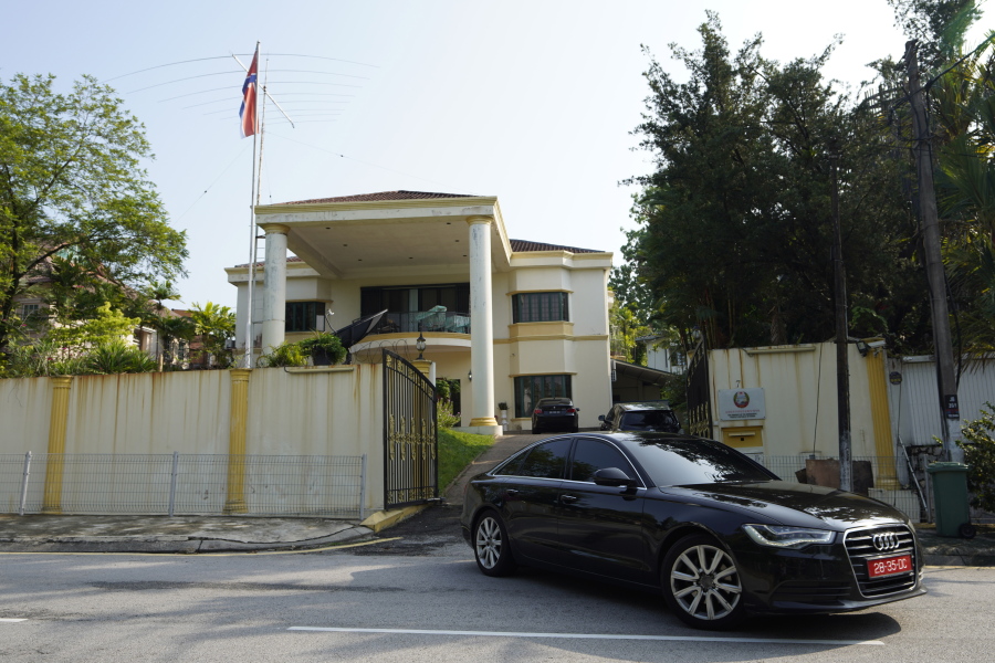 A car goes out of the North Korean Embassy in Kuala Lumpur, Malaysia, Friday, March 19, 2021. North Korea on Friday said it was cutting diplomatic ties with Malaysia to protest a recent court ruling that allows a North Korean citizen to be extradited to the United States to face money laundering charges.