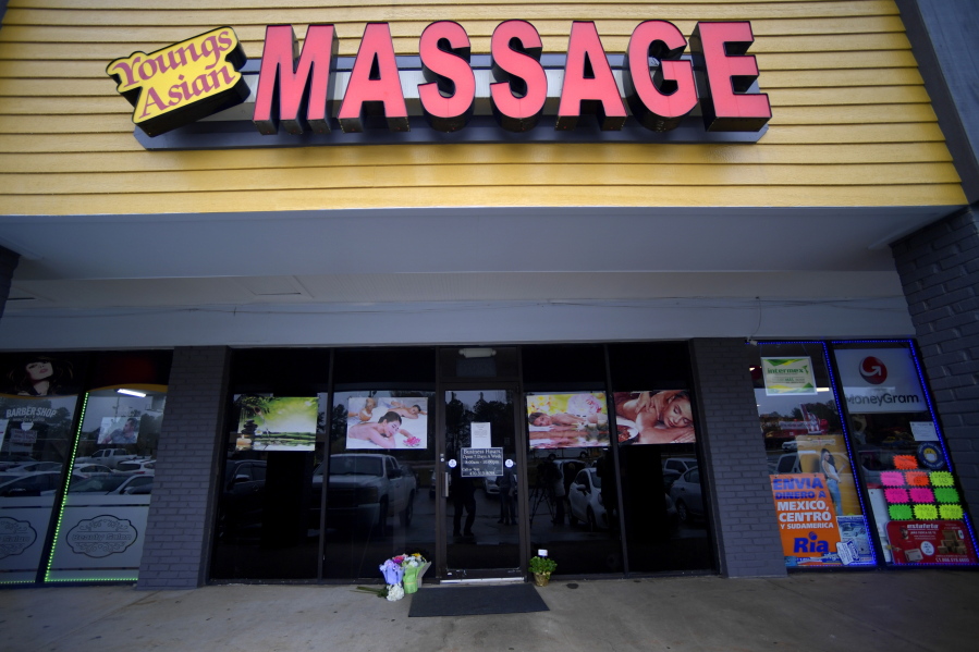 A make-shift memorial is seen outside a business where a multiple fatal shooting occurred on Tuesday, Wednesday, March 17, 2021, in Acworth, Ga.  Robert Aaron Long, a white man, is accused of killing several people, most of whom were of Asian descent, at massage parlors in the Atlanta area.