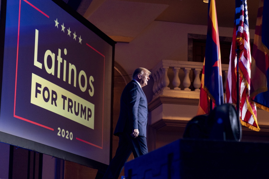 FILE - In this Sept. 14, 2020 file photo, President Donald Trump arrives for a Latinos for Trump Coalition roundtable at Arizona Grand Resort &amp; Spa in Phoenix.