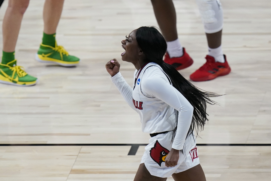 Louisville guard Dana Evans (1) celebrates a score against the Oregon during the first half of a college basketball game in the Sweet Sixteen round of the women&#039;s NCAA tournament at the Alamodome in San Antonio, Sunday, March 28, 2021.