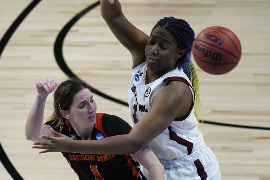 Oregon State guard Aleah Goodman, left, passes around South Carolina forward Aliyah Boston, right, during the second half of a college basketball game in the second round of the women&#039;s NCAA tournament at the Alamodome in San Antonio, Tuesday, March 23, 2021.
