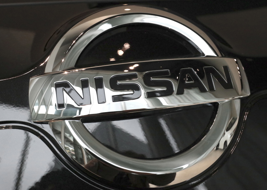 FILE - In this Feb. 9, 2017 file photo, the logo of the Nissan Motor Co. is seen on a car displayed at the gallery of its global headquarters in Yokohama, near Tokyo. Nissan is recalling more than 854,000 cars in the U.S. and Canada because the brake lights might not come on when the driver presses on the pedal. The recall covers certain Sentra compacts from the 2016 through 2019 model years, including more than 807,000 in the U.S.