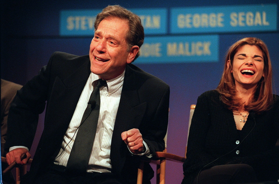 FILE - Cast members from the NBC &quot;Just Shoot Me,&quot; George Segal, left, and Laura San-Giacomo appear at the TCA winter press tour in Pasadena, Calif. on  Jan. 10, 1997. Segal, the banjo player turned actor who was nominated for an Oscar for 1966&#039;s &quot;Who&#039;s Afraid of Virginia Woolf?,&quot; and starred in the ABC sitcom &quot;The Goldbergs,&quot; and the NBC sitcom &quot;Just Shoot Me,&quot; died Tuesday, his wife said. He was 87.
