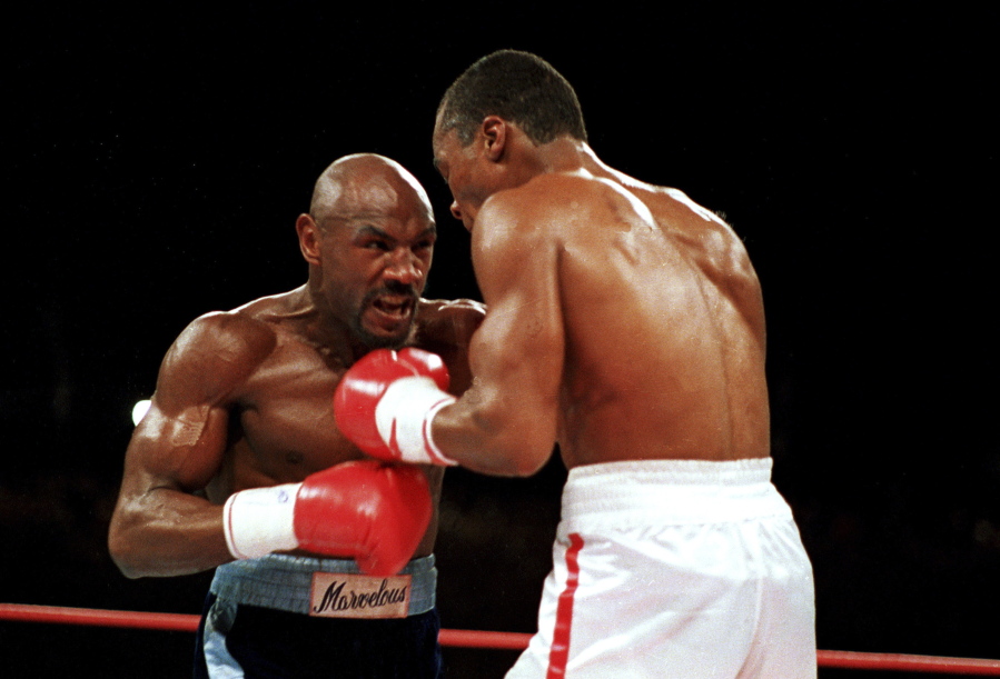 &quot;Marvelous&quot; Marvin Hagler, left, moves in on &quot;Sugar&quot; Ray Leonard during their bout in 1987. Hagler, the middleweight boxing great whose title reign and career ended with the loss to Leonard in 1987, died Saturday, March 13, 2021. He was 66.