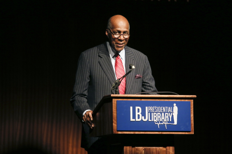 FILE - In this April 9, 2014 file photo, civil rights activist Vernon Jordan introduces former President Bill Clinton during the Civil Rights Summit in Austin, Texas. Jordan, who rose from humble beginnings in the segregated South to become a champion of civil rights before reinventing himself as a Washington insider and corporate influencer, died Tuesday, March 2, 2021, according to a statement from his daughter. He was 85.