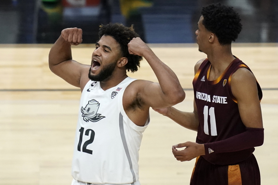 Oregon&#039;s LJ Figueroa (12) celebrates after a play against Arizona State during the second half of an NCAA college basketball game in the quarterfinal round of the Pac-12 men&#039;s tournament Thursday, March 11, 2021, in Las Vegas.