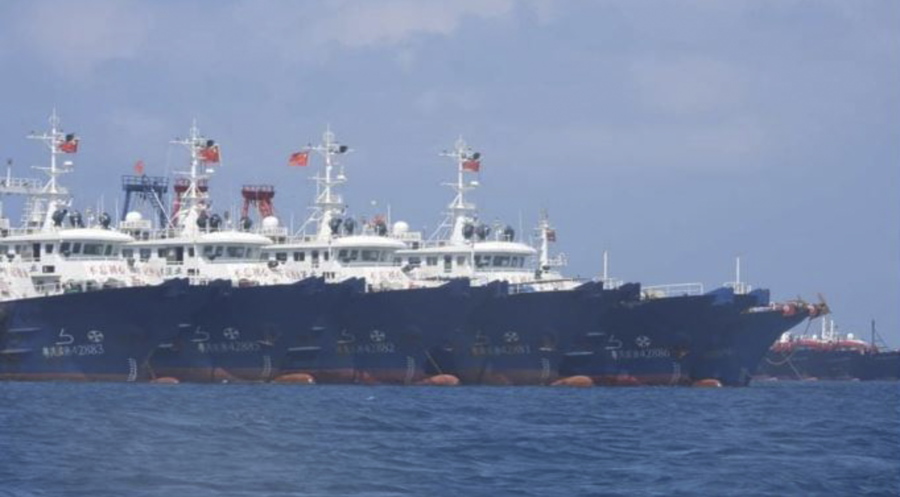 In this March 7, 2021, photo provided by the Philippine Coast Guard/National Task Force-West Philippine Sea, some of the 220 Chinese vessels are seen moored at Whitsun Reef, South China Sea. The Philippine government expressed concern after spotting more than 200 Chinese fishing vessels it believed were crewed by militias at a reef claimed by both countries in the South China Sea, but it did not immediately lodge a protest.