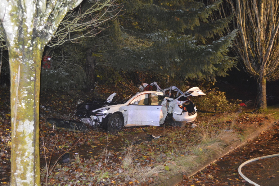 FILE - In this Nov. 17, 2020, file photo provided by the Corvallis Police Department is the scene where an Oregon man crashed a Tesla while going about 100 mph, destroying the vehicle, a power pole and starting a fire when some of the hundreds of batteries from the vehicle broke windows and landed in residences in Corvallis, Ore. Dylan Milota, who survived the crash, was driving the 2019 Tesla S when he lost control. Pandemic lockdowns and stay-at-home orders kept many drivers off U.S. roads and highways in 2020. But those who did venture out found open lanes that only invited reckless driving, leading to a sharp increase in traffic-crash deaths across the country.