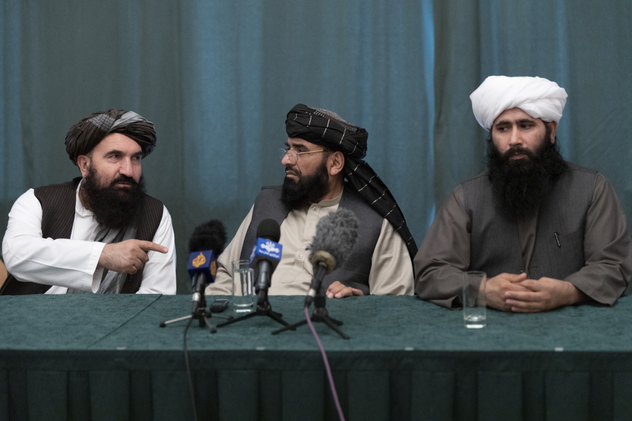 Members of the Taliban delegation from the left: Khairullah Khairkhwa, former western Herat Governor and one of five Taliban released from the U.S. prison on Guantanamo Bay in exchange for U.S. soldier Bowe Bergdahl, Suhail Shaheen, member of negotiation team, Mohammad Naeem, spokesman for the Taliban&#039;s political office attend their joint news conference in Moscow, Russia, Friday, March 19, 2021. The Taliban warned Washington against defying a May 1 deadline for the withdrawal of American and NATO troops from Afghanistan promising a &quot;reaction&quot;.