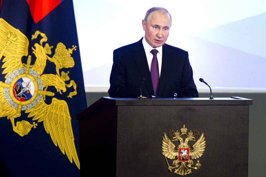 Russian President Vladimir Putin speaks to top Interior Ministry officials in Moscow, Russia, Wednesday, March 3, 2021. Putin urged the Interior Ministry to track down those who draw children to unsanctioned demonstrations.